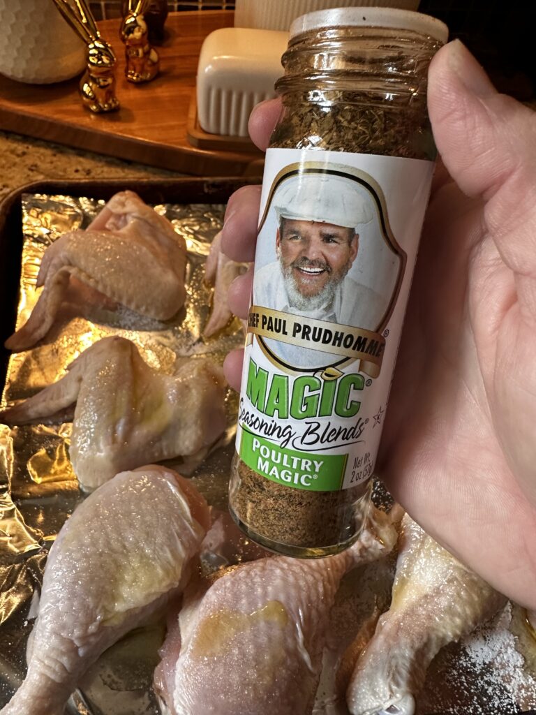 A shaker of Paul Prudhomme "Poultry Magic" seasoning blend