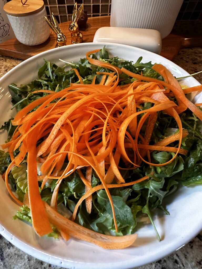 Carrot ribbons over greens
