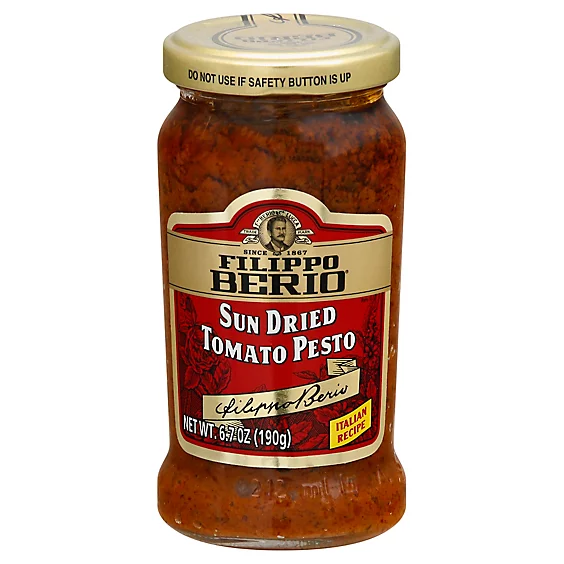 A jar of sun dried tomato pesto