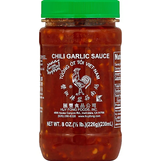 A plastic jar of chili garlic sauce