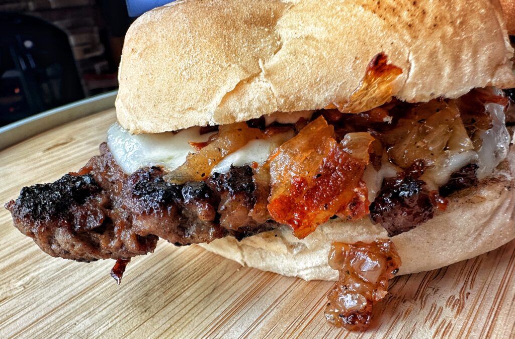A close up of a maple bacon smash burger