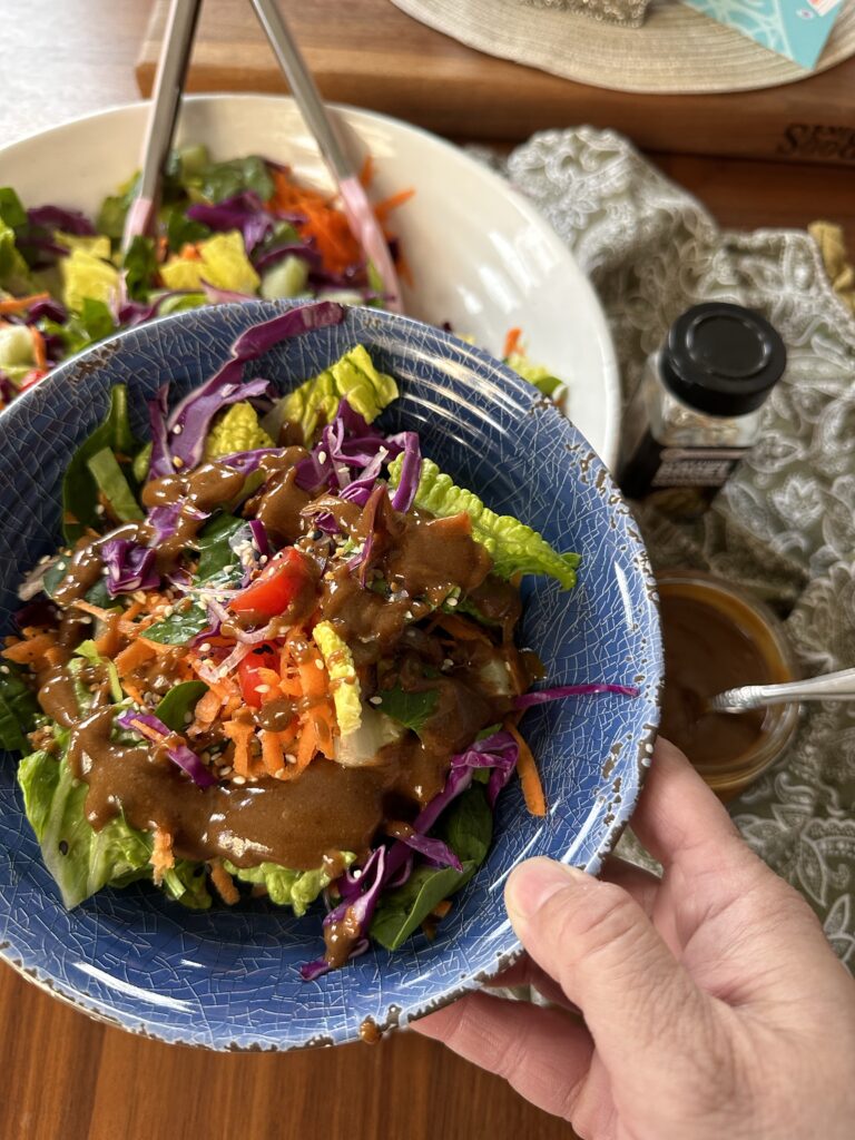A bowl of Thai Crunch Salad with peanut dressing