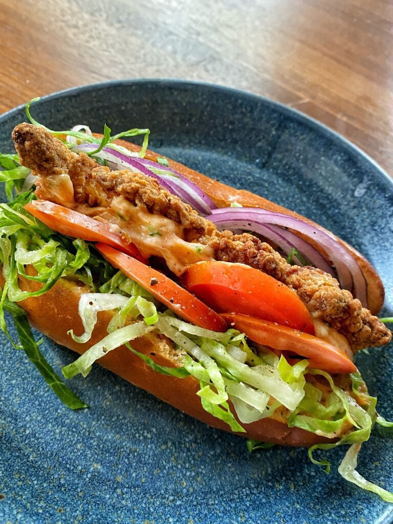 A bird dog sandwich on a blue plate