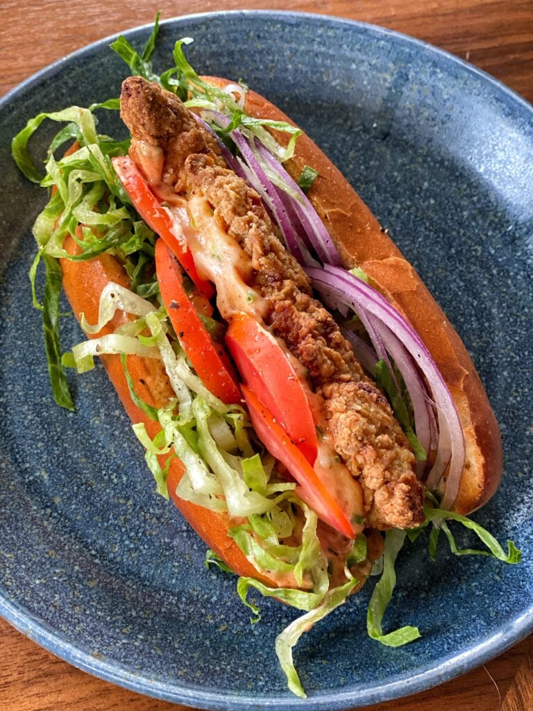 A Bird Dog Sandwich on a blue plate