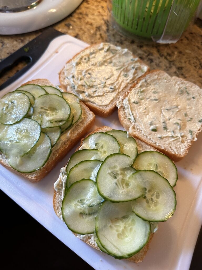 Cucumber sandwiches with the top piece of bread removed 