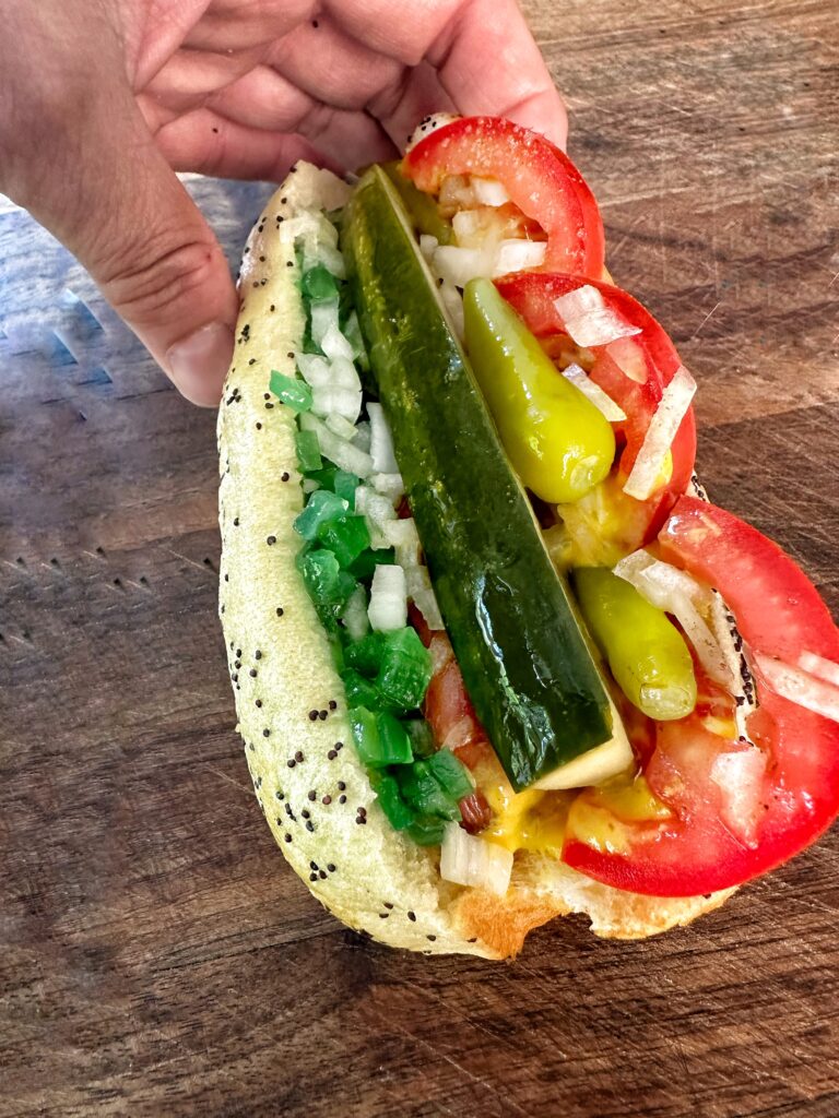 A close up of a fully topped Chicago Style Hot Dog
