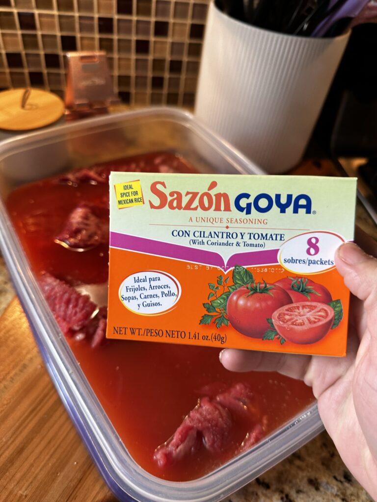A package of Sazon Goya tomato seasoning