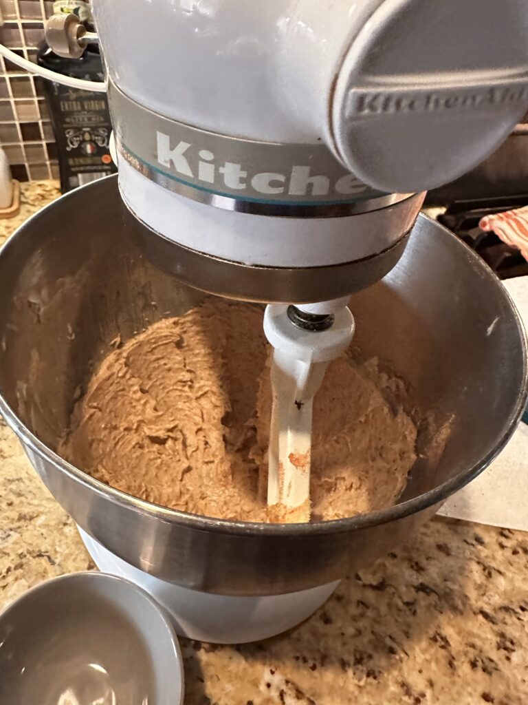 Butter being whipped in a stand mixer