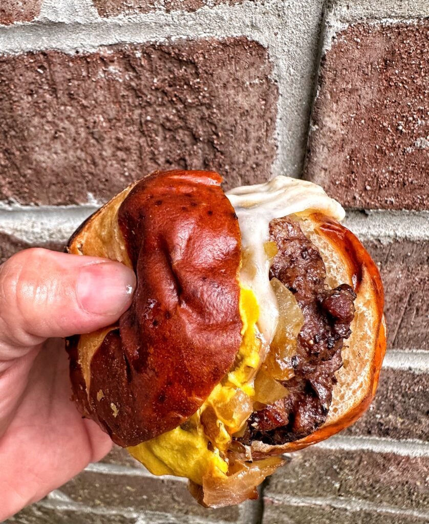 A close up of a cheeseburger