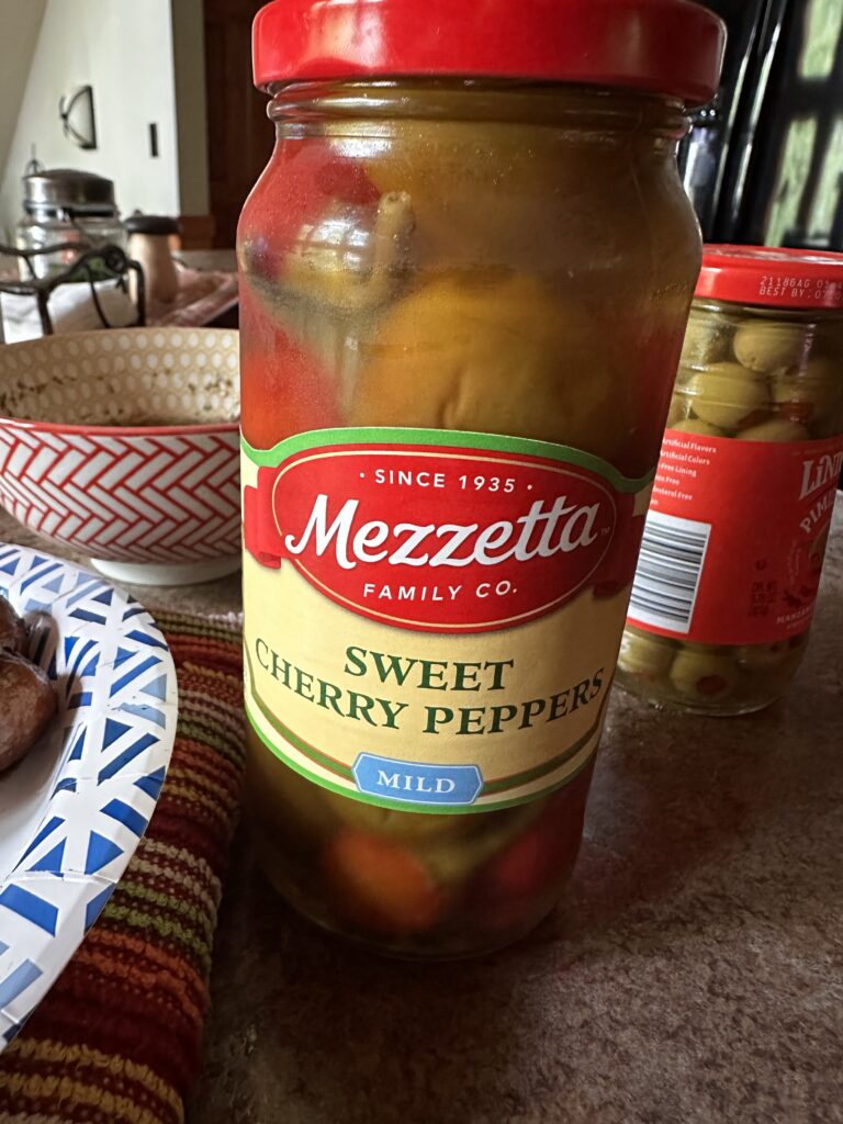 A jar of sweet cherry peppers