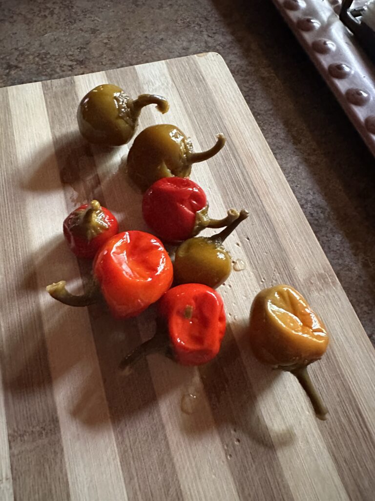 Cherry peppers on a cutting board