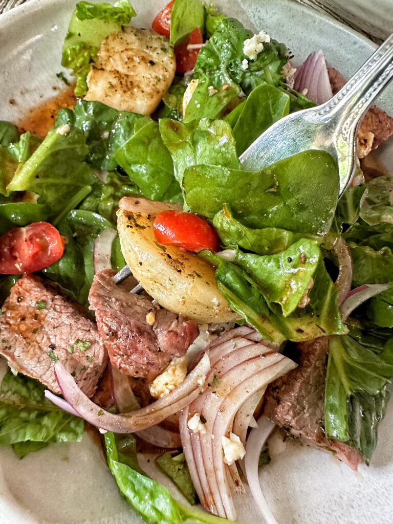 A forkful of steakhouse salad