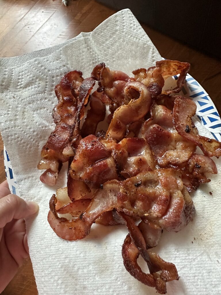 Cooked bacon on a paper towel