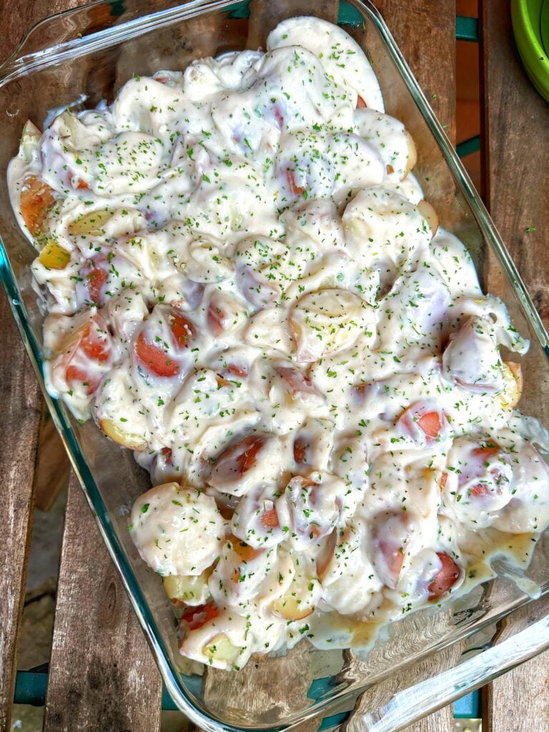 A glass baking dish of creamed potatoes