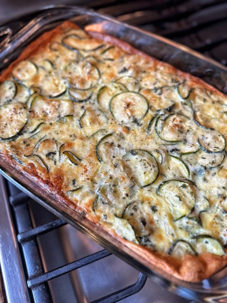 Cheesy zucchini in a glass baking dish
