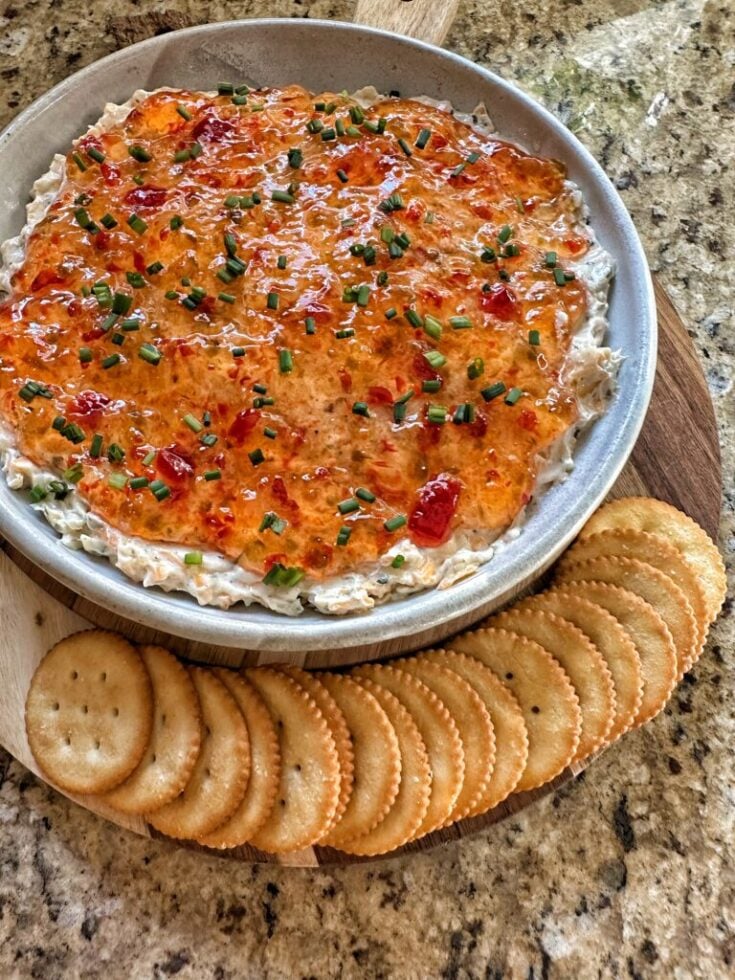 Pepper Jelly Cheese Dip with crackers laid out along the side