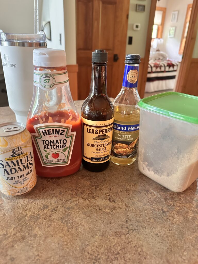 Ingredients for the beer BBQ sauce, including beer, ketchup, Worcestershire sauce, and cooking wine