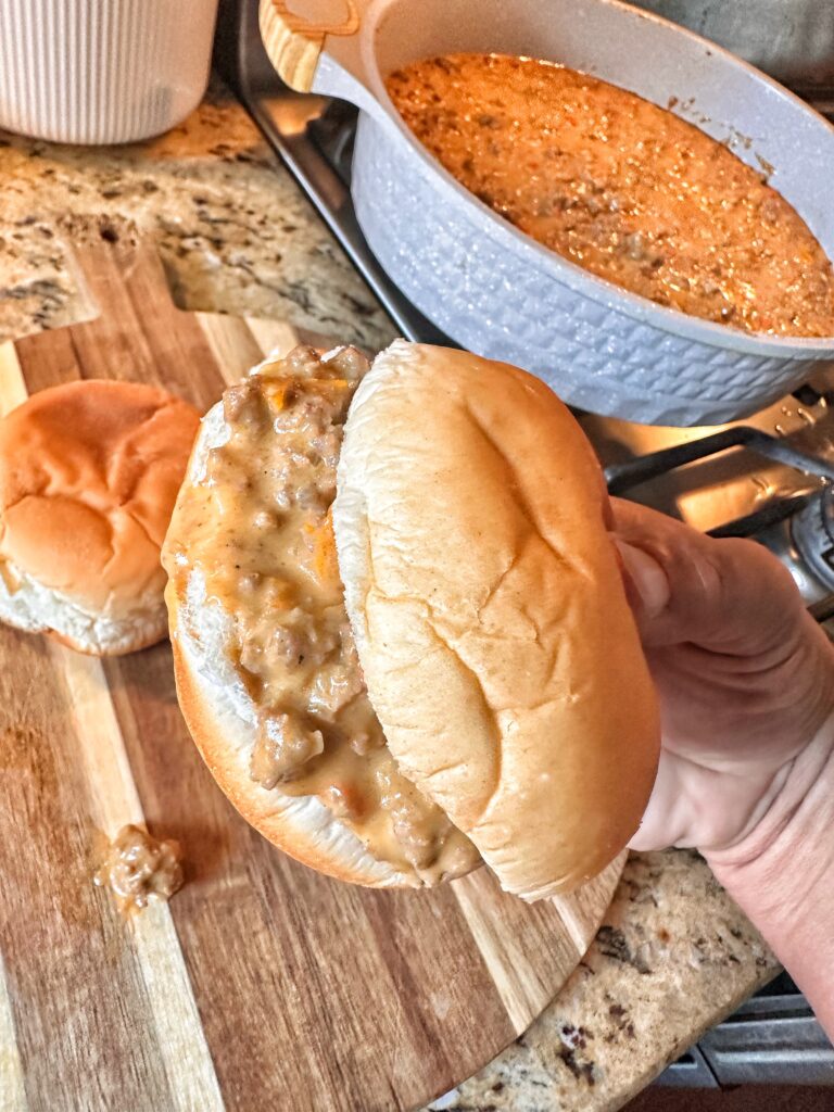 A close up of a cheesy sloppy joe