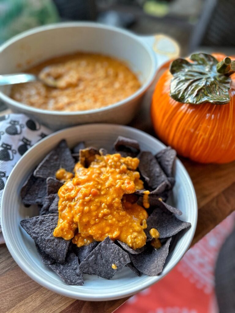 Cheesy Chicken Queso over black corn chips