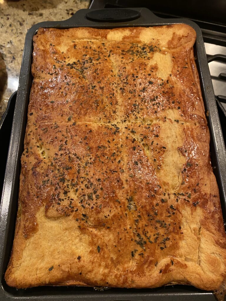 A fully baked, unsliced Antipasto Bake