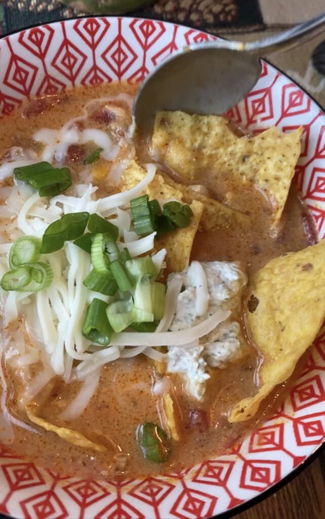 A close up of the finished chicken enchilada soup.