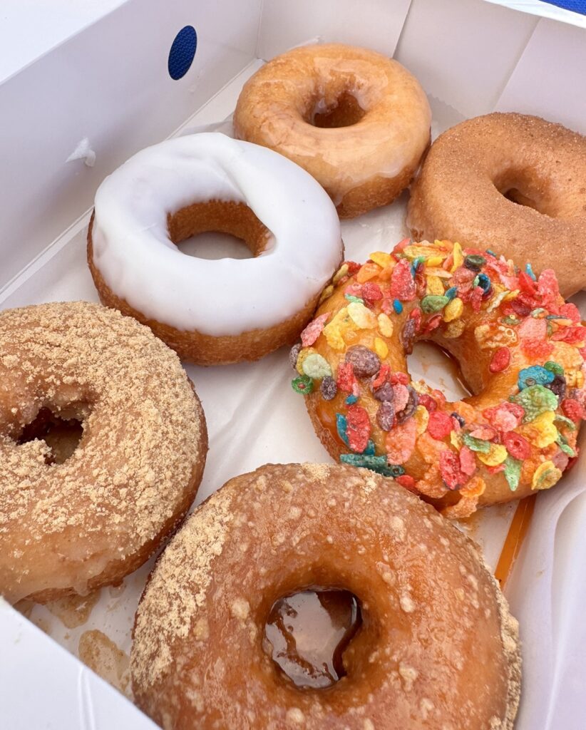 A box with a variety of six donuts.