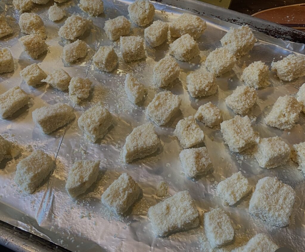 Bread cubes on a baking sheet