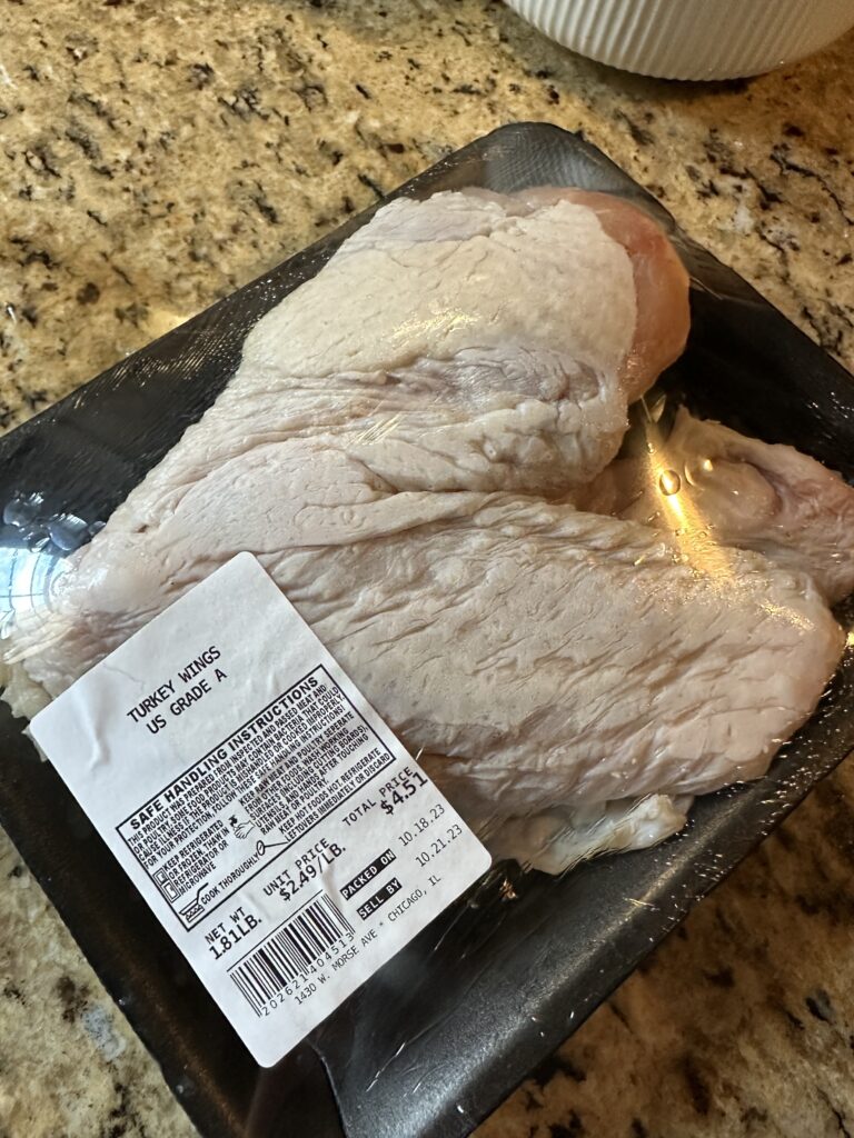A packaged raw turkey wing