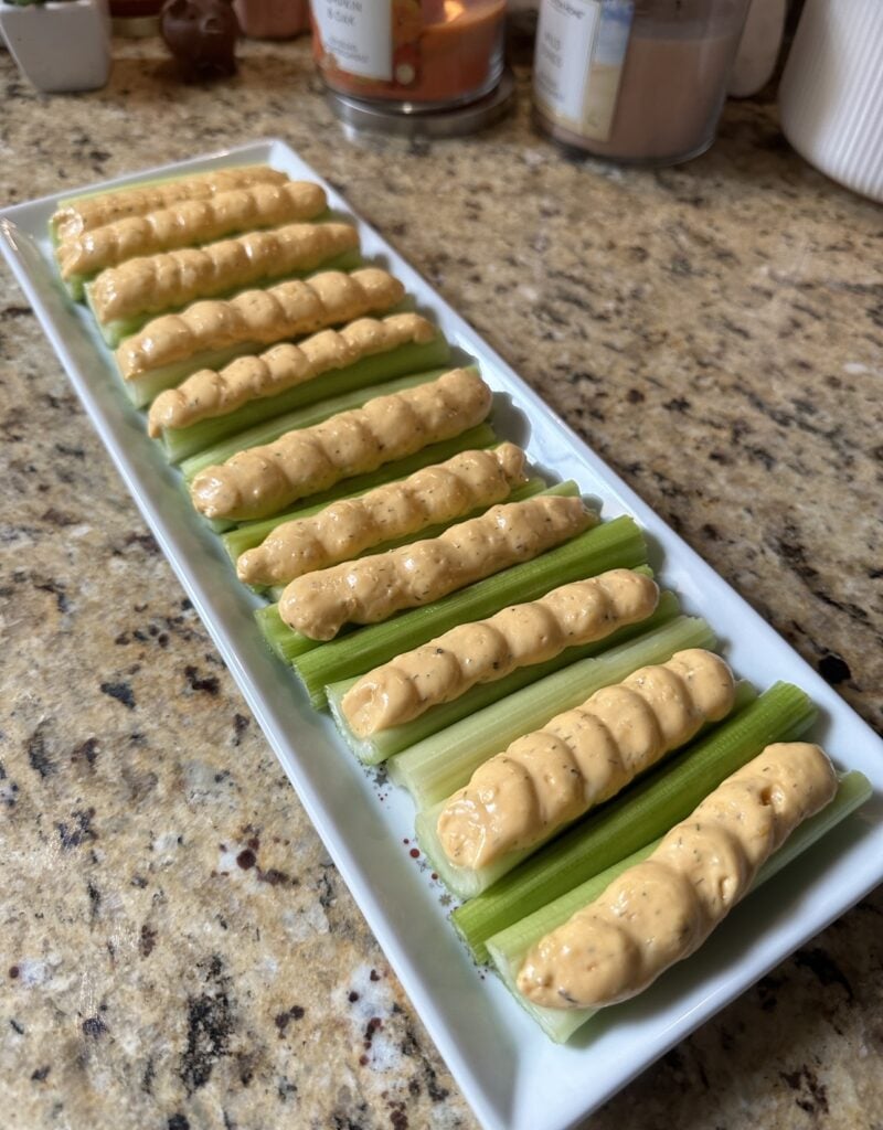 The stuffed celery before toppings are added