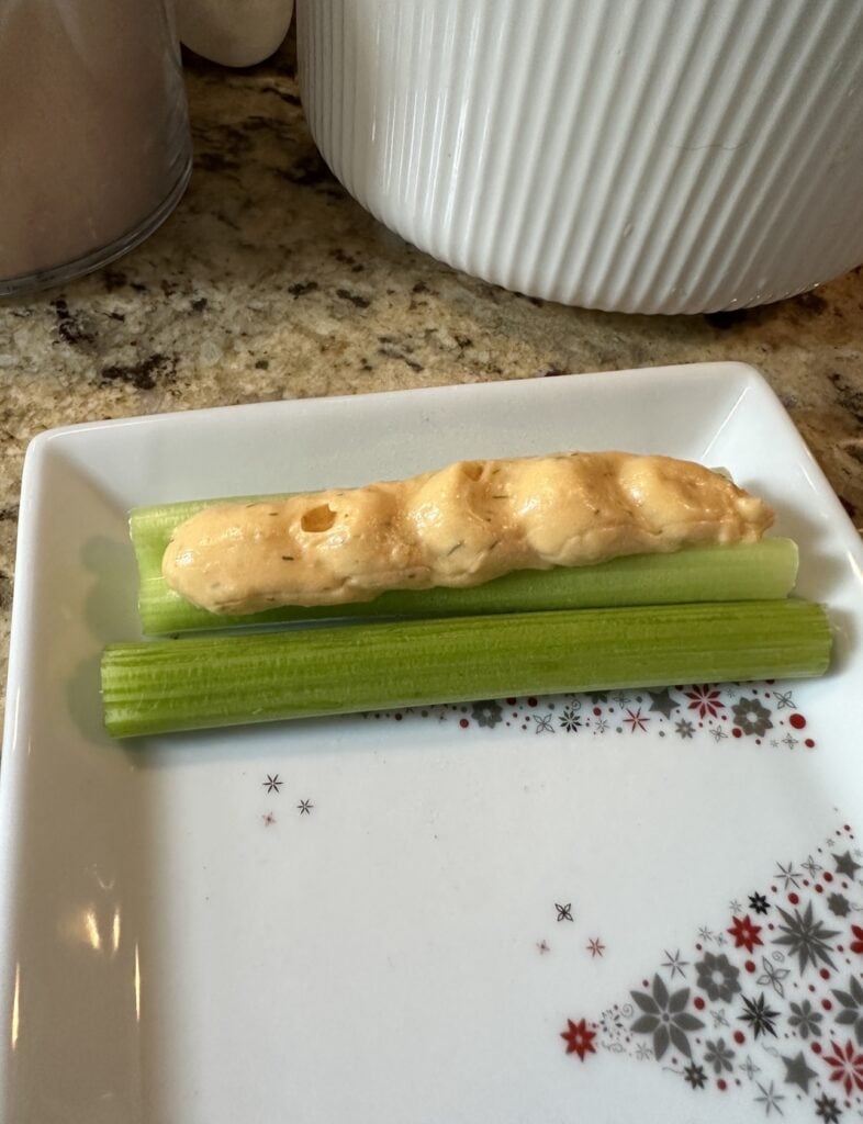 One stuffed and one unstuffed celery
