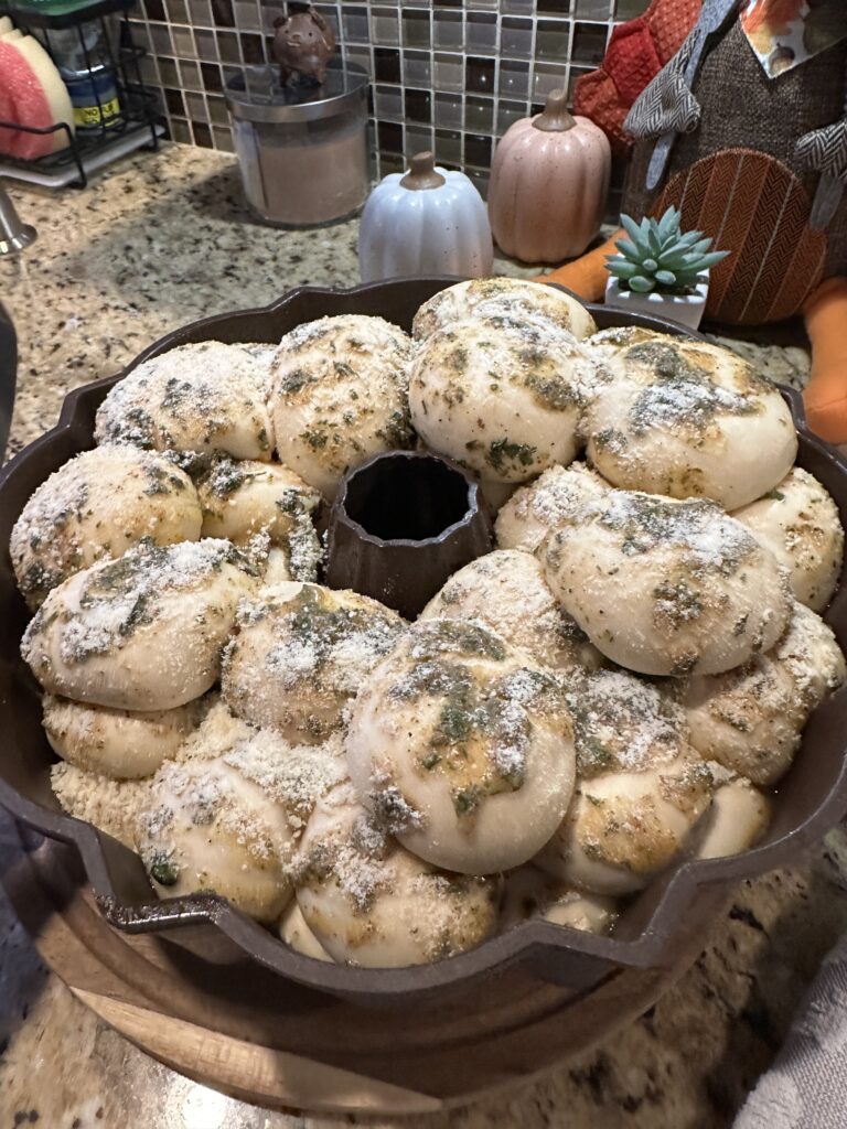 Buttery rolls in a baking tin before being cooked