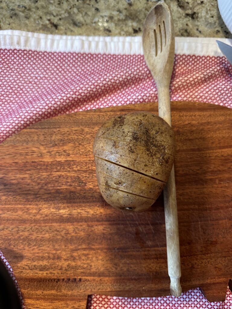 A sliced potato on a cutting board