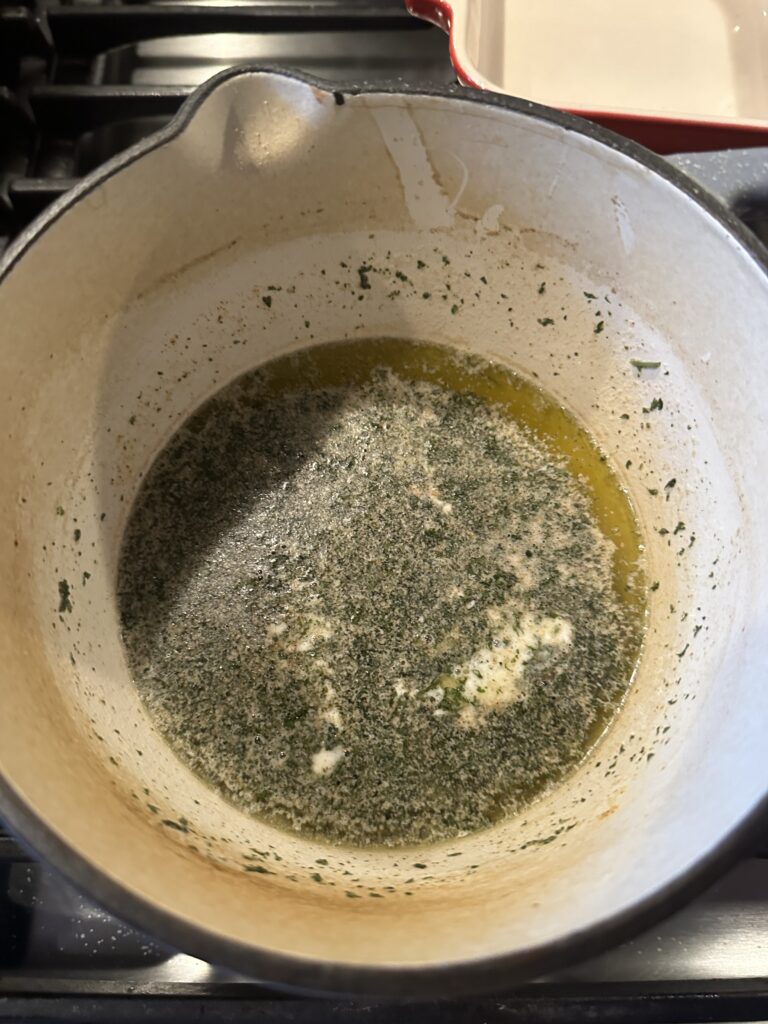 A butter and herb mixture in a pot