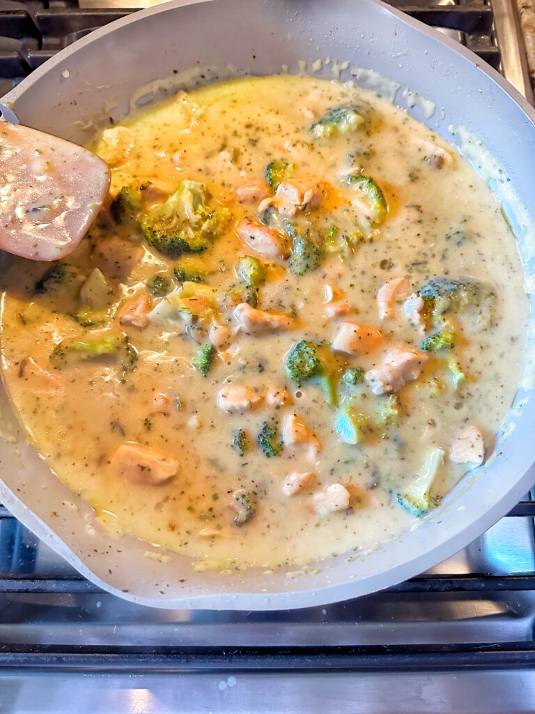 Cheesy chicken and broccoli cooking in the pan