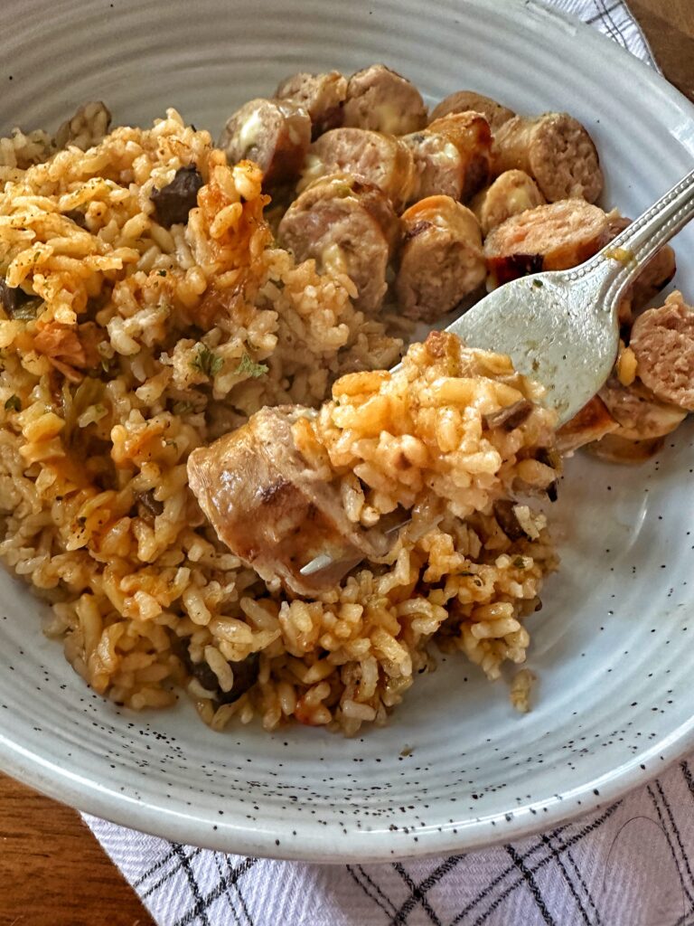Rice and sausage on a fork