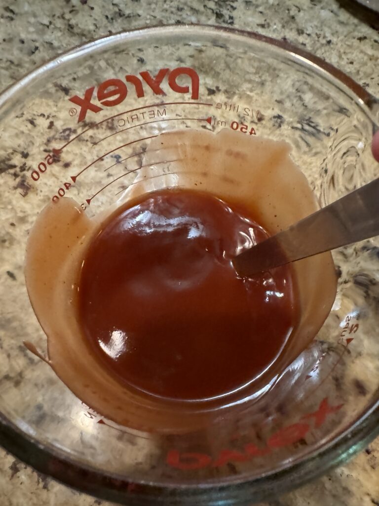 Barbecue sauce in a measuring cup