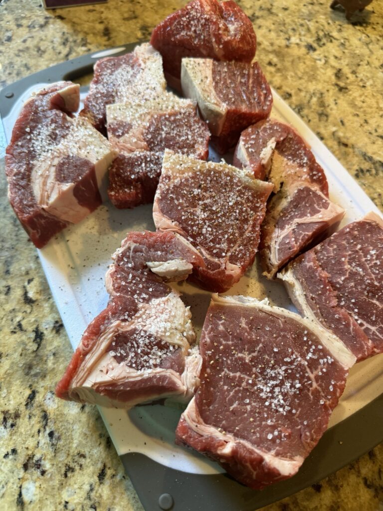 Raw roast chunks with seasoning on top