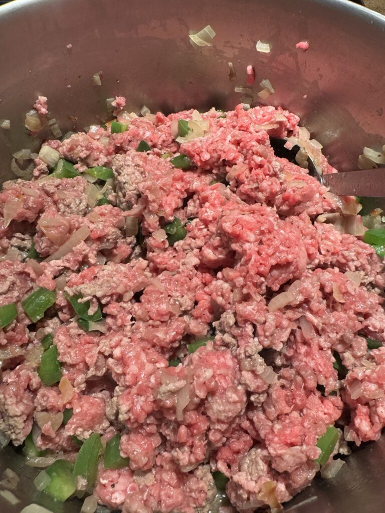 Ground meat mixed with peppers and onion