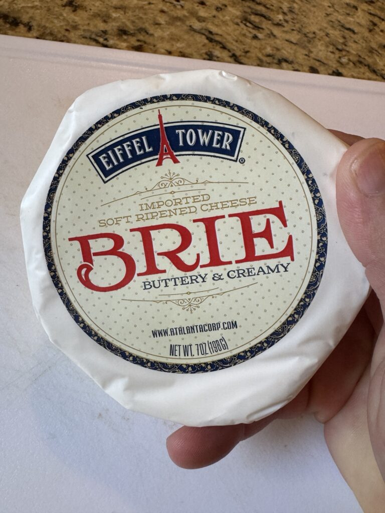 A package of round brie cheese