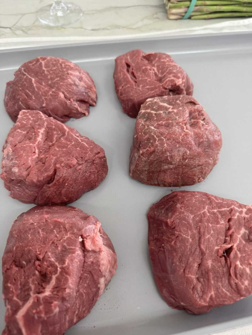 Six raw steaks