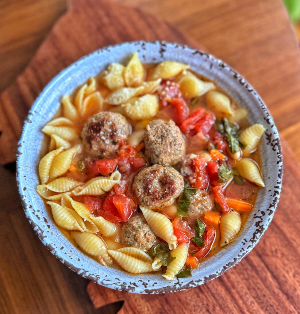 Meatball soup with shell pasta and veggies