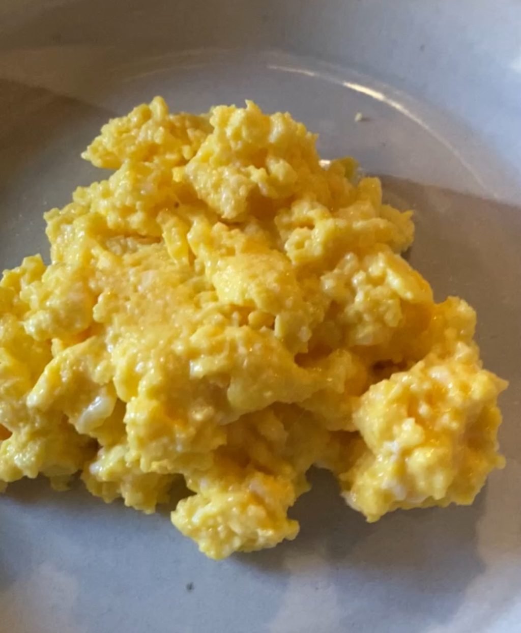 Fluffy scrambled eggs on a plate