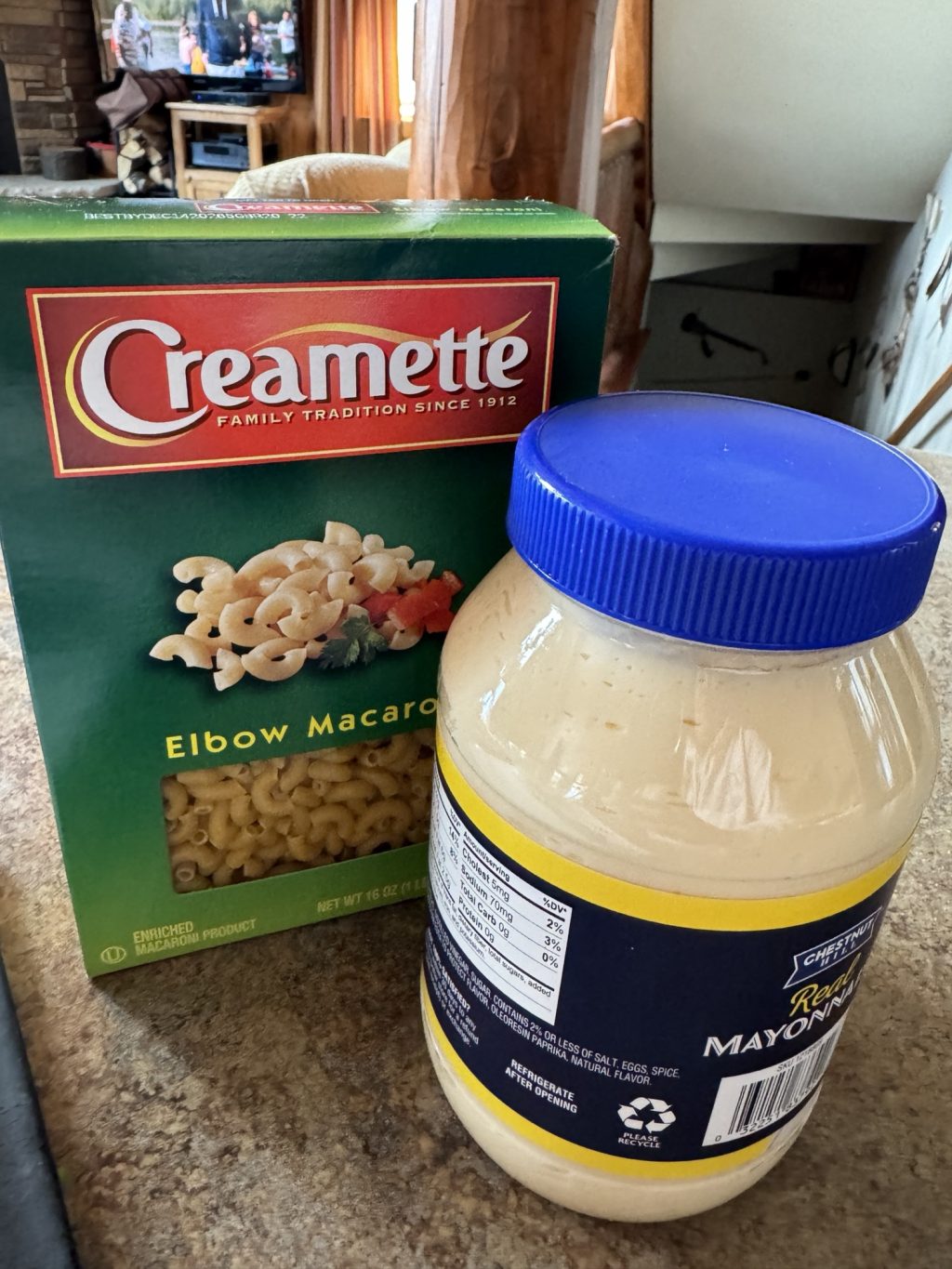 A box of Creamette brand macaroni noodles next to a jar of mayonnaise