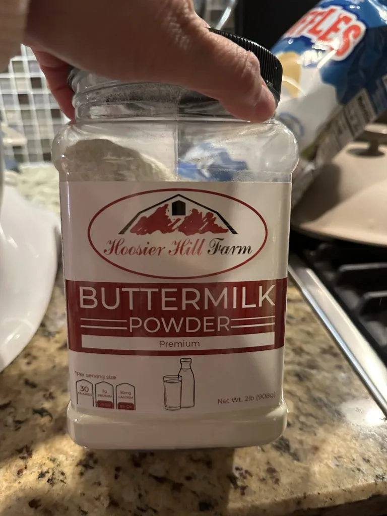 A plastic container of buttermilk powder