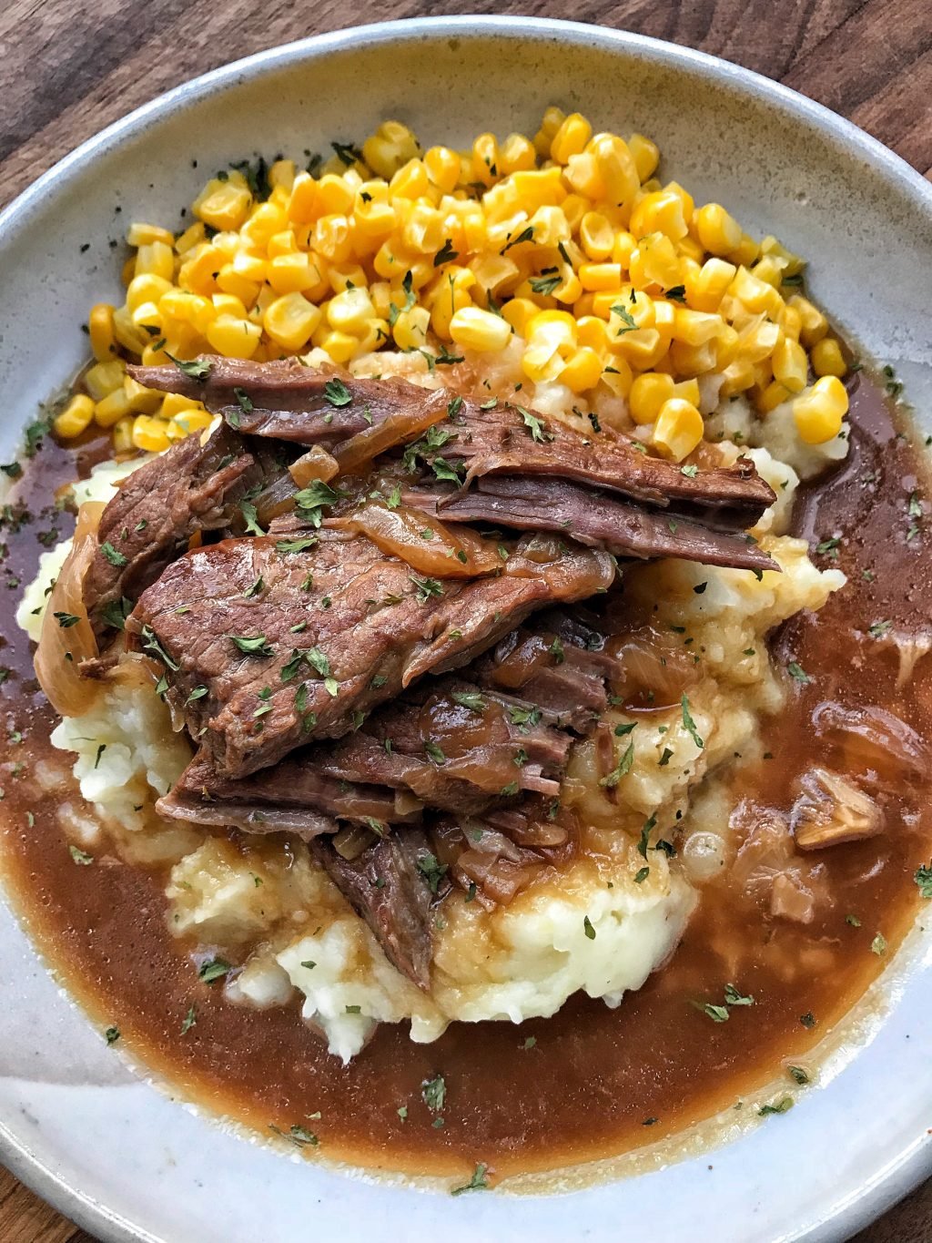 Round steak and corn over mashed potatoes and gravy