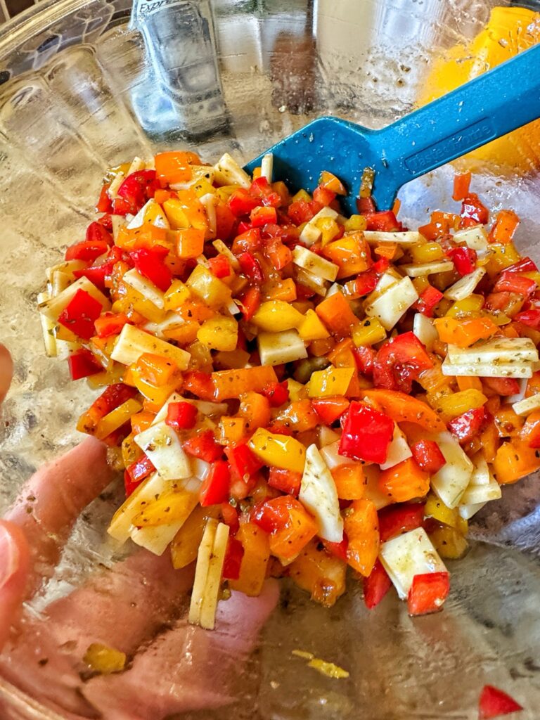 The completed pepper and provolone salad in a glass bowl