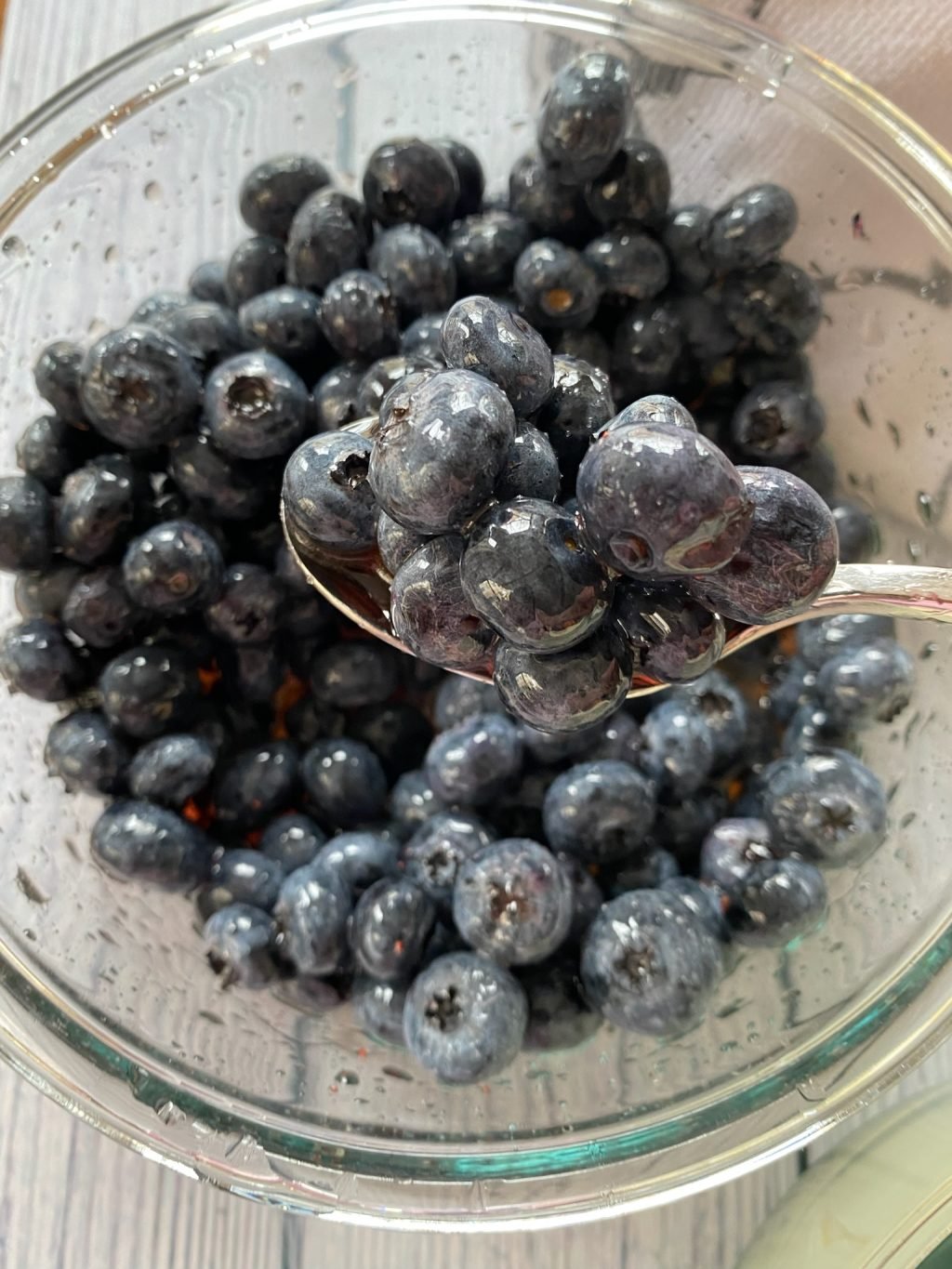 Blueberries in a bowl and on a spoon