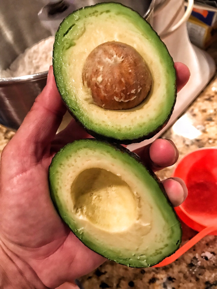 An avocado split in half