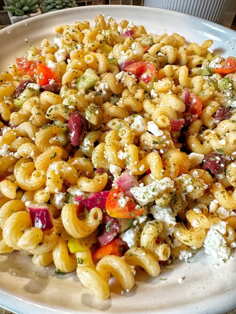 Corkscrew pasta with feta cheese and olives and peppers and tomatoes