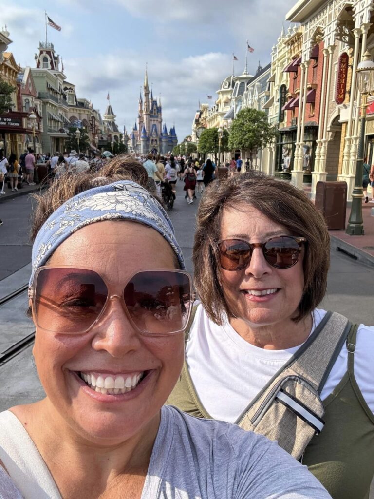My mom and me on the streets of Disney with the Magic Kingdom castle in the background.